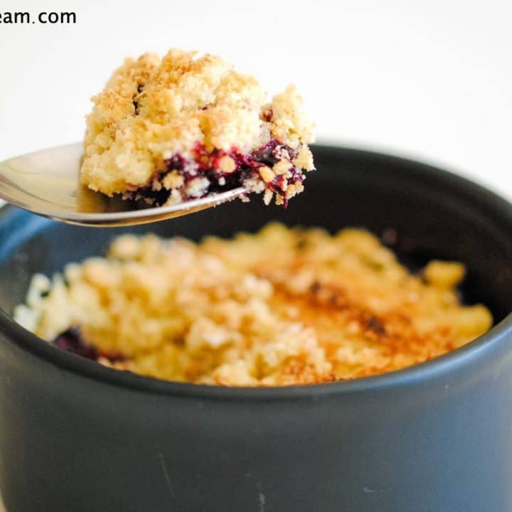 a spoonful of berry crumble over the dish of crumble